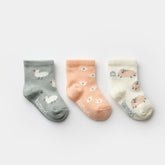 3-pack baby girl socks with duck, flower, and sheep designs in soft colors